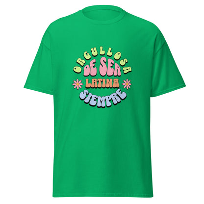 Retro groovy t-shirt design featuring "ORGULLOSA DE SER LATINA SIEMPRE" in curved bubble letters - lime green for "ORGULLOSA", soft pink for "DE SER", coral orange for "LATINA", and sky blue for "SIEMPRE", decorated with pink daisy flowers with yellow centers on both sides