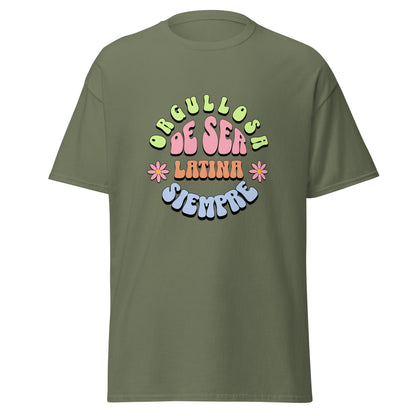 Retro groovy t-shirt design featuring "ORGULLOSA DE SER LATINA SIEMPRE" in curved bubble letters - lime green for "ORGULLOSA", soft pink for "DE SER", coral orange for "LATINA", and sky blue for "SIEMPRE", decorated with pink daisy flowers with yellow centers on both sides