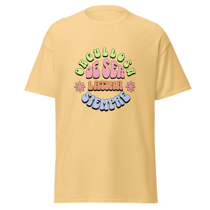 Retro groovy t-shirt design featuring "ORGULLOSA DE SER LATINA SIEMPRE" in curved bubble letters - lime green for "ORGULLOSA", soft pink for "DE SER", coral orange for "LATINA", and sky blue for "SIEMPRE", decorated with pink daisy flowers with yellow centers on both sides