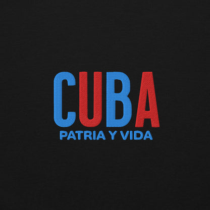 Bordado con la frase “Patria y Vida”, inspiración cultural de Cuba.